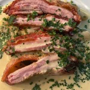 Bouchon Racine Suckling pig from Normandy and a Calvados sauce naturellement